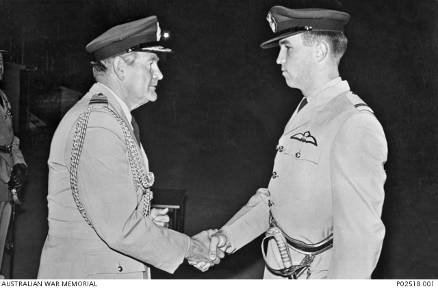 Air Chief Marshal Sir Wallace Kyle GCB CBE DSO DFC ADC (RAF) (left) shakes hands with Flying Officer Michael Patrick John Herbert RAAF. (photo via Australian War Memorial)