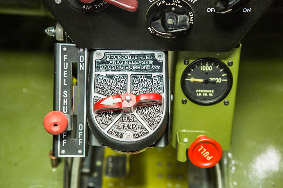 A closer shot shows detail of the fuel shut off, fuel selector, hydraulic pressure gauge, and the red pull knob that would dump hydraulic pressure when pulled. (photo via AirCorps Aviation)