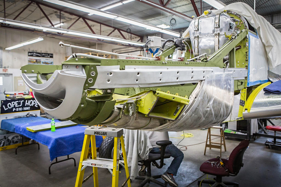 The oil tank is on the firewall and the engine mount assemblies support the “smile”, lower rear cowl section, and the air cleaner boxes. (photo via AirCorps Aviation)