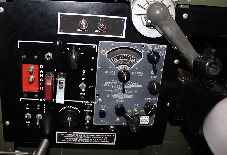 Pilot’s radio package. Note the impact destruct switch (the red panel with two silver buttons). (photo via Tom Reilly)