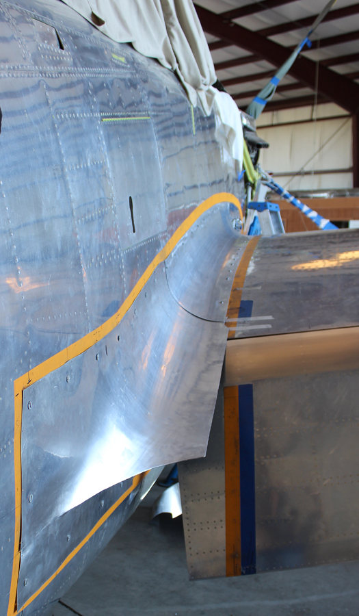 The righthand outboard fuselage-to-center section fairing in place during trial fitting. (photo via Tom Reilly)
