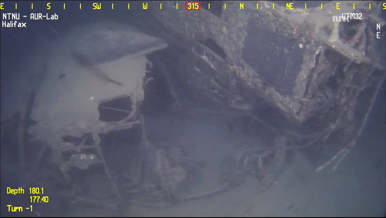 The Halifax's forward fuselage torn from the aircraft, lies on its left side beside the cockpit. (screen capture of video fromNTNU AUR-LAB)