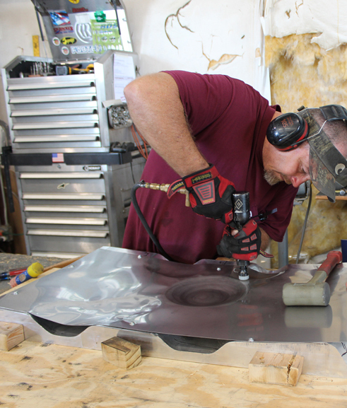 Shaping stainless steel sheet into the liners for the interior of the main gear doors. (photo via Tom Reilly) 
