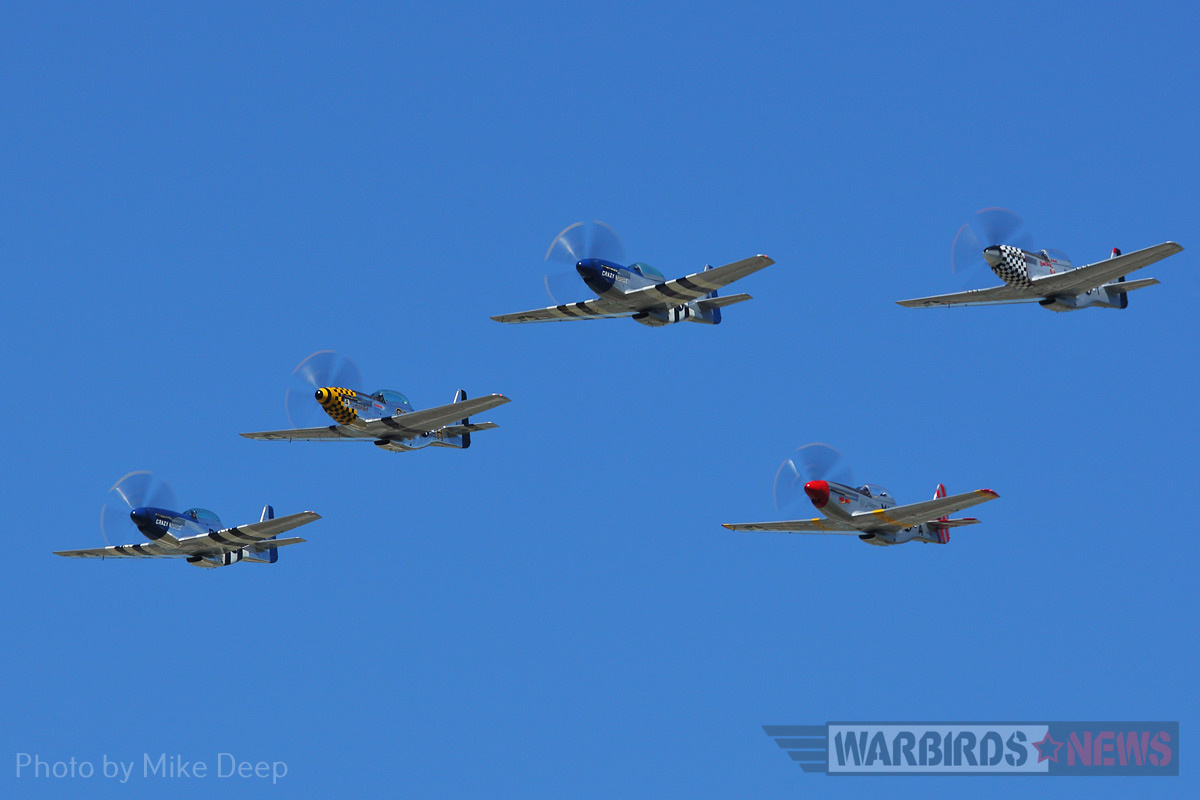 Five Mustangs fly in formation during Thursday’s Warbird demonstration. From left to right: ‘Crazy Horse²,’ ‘The Little Witch,’ ‘Crazy Horse,’ ‘Mad Max,’ and ‘Bum Steer.’ 