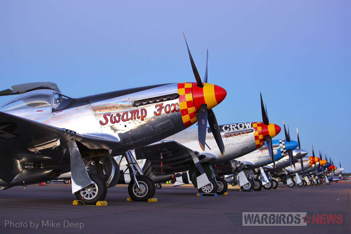 A row of Mustangs, seen here in twilight Thursday, held a commanding presence on the Warbird Ramp for most of Sun ‘n Fun. 