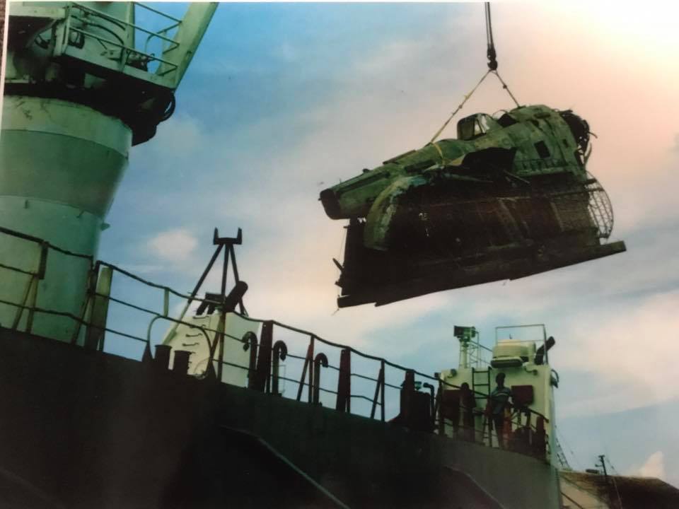 The Grumman Duck being hoisted aboard a ship bound for Miami following its recovery in the Bahamas. (photo via Mid America Flight Museum)