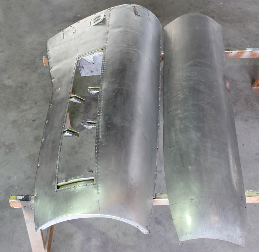 A completed cowling panel (left) beside the newly wheeled skin for its counterpart to the right. (photo via Tom Reilly)