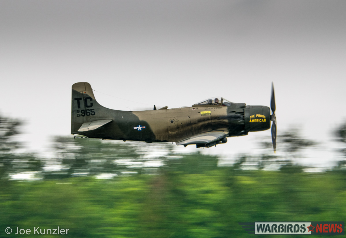 HFM's Skyraider performs for the crowd during a rain-soaked Fly Day on June 18th. (photo by Joe Kunzler)