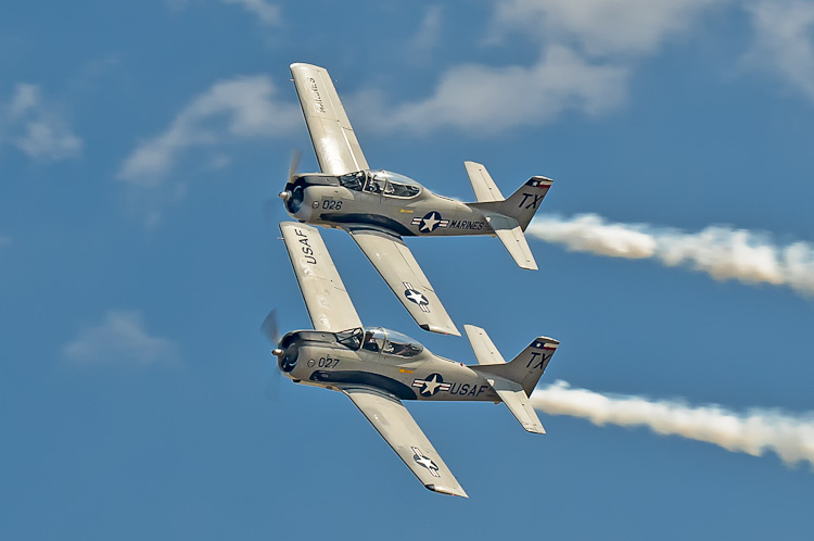  The Trojan Phlyers own and operate two T-28B aircraft. Both aircraft have Wright Cyclone R1820-86B nine-cylinder radial engines rated at 1425 horsepower. The fully aerobatic aircraft can takeoff in less than 800 feet of runway, climb to 10,000 feet in less than 90 seconds, race level above 335 MPH, and dive faster than 380 MPH. In fact, the T28 can outperform most World War II fighters at low altitude.