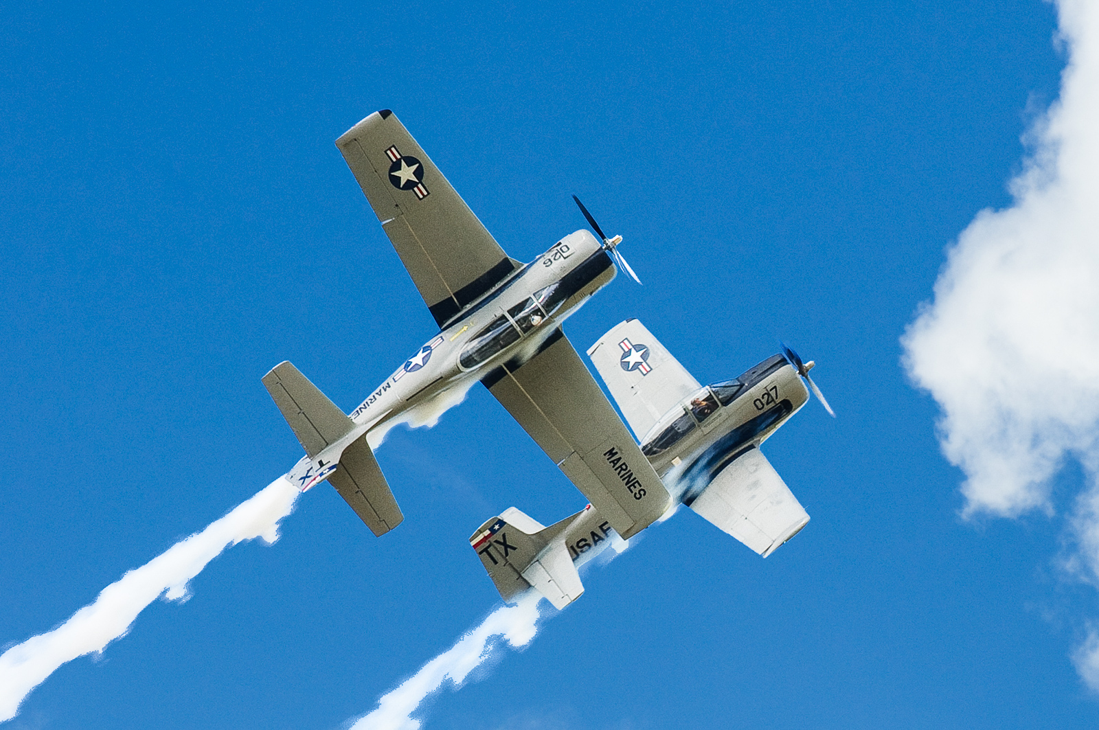 The two T-28Bs of the Trojan Phlyers perform close-in formation aerobatics, as is amply demonstrated here. (photo via Trojan Phlyers)