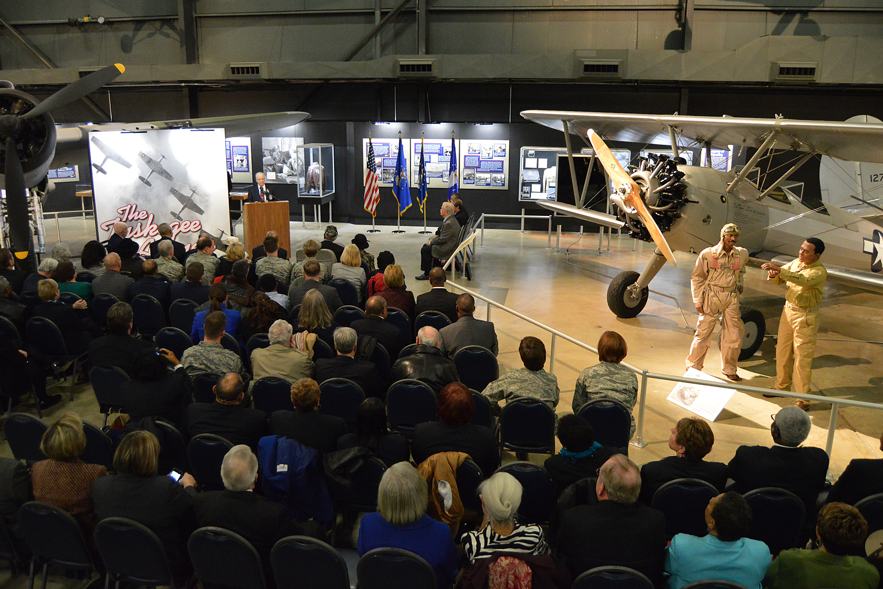 Tuskegee Airmen, families, friends and guests, gathered for the expanded Tuskegee Airmen exhibit opening in the WWII Gallery at the National Museum of the U.S. Air Force on Feb. 10, 2015. (U.S. Air Force photo) 