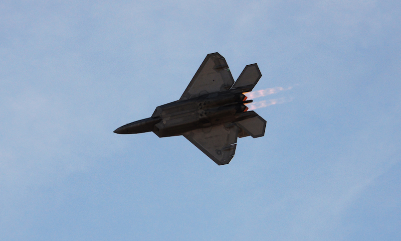 A U.S. Air Force F-22 Raptor flies above spectators during the 2017 Heritage Flight Training and Certification Course at Davis-Monthan Air Force Base, Ariz., Feb. 10, 2017. During the course, aircrews practice ground and flight training to enable civilian pilots of historic military aircraft and U.S. Air Force pilots of current fighter aircraft to fly safely in formations together. (U.S. Air Force photo by Airman 1st Class Giovanni Sims)