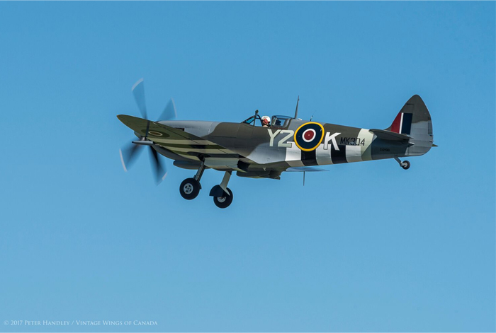 A great shot of the Roseland Spitfire as she climbs back into the sky. The first flight would be carried out a low speed with the landing gear extended throughout. Photo: Peter Handley, Vintage Wings of Canada