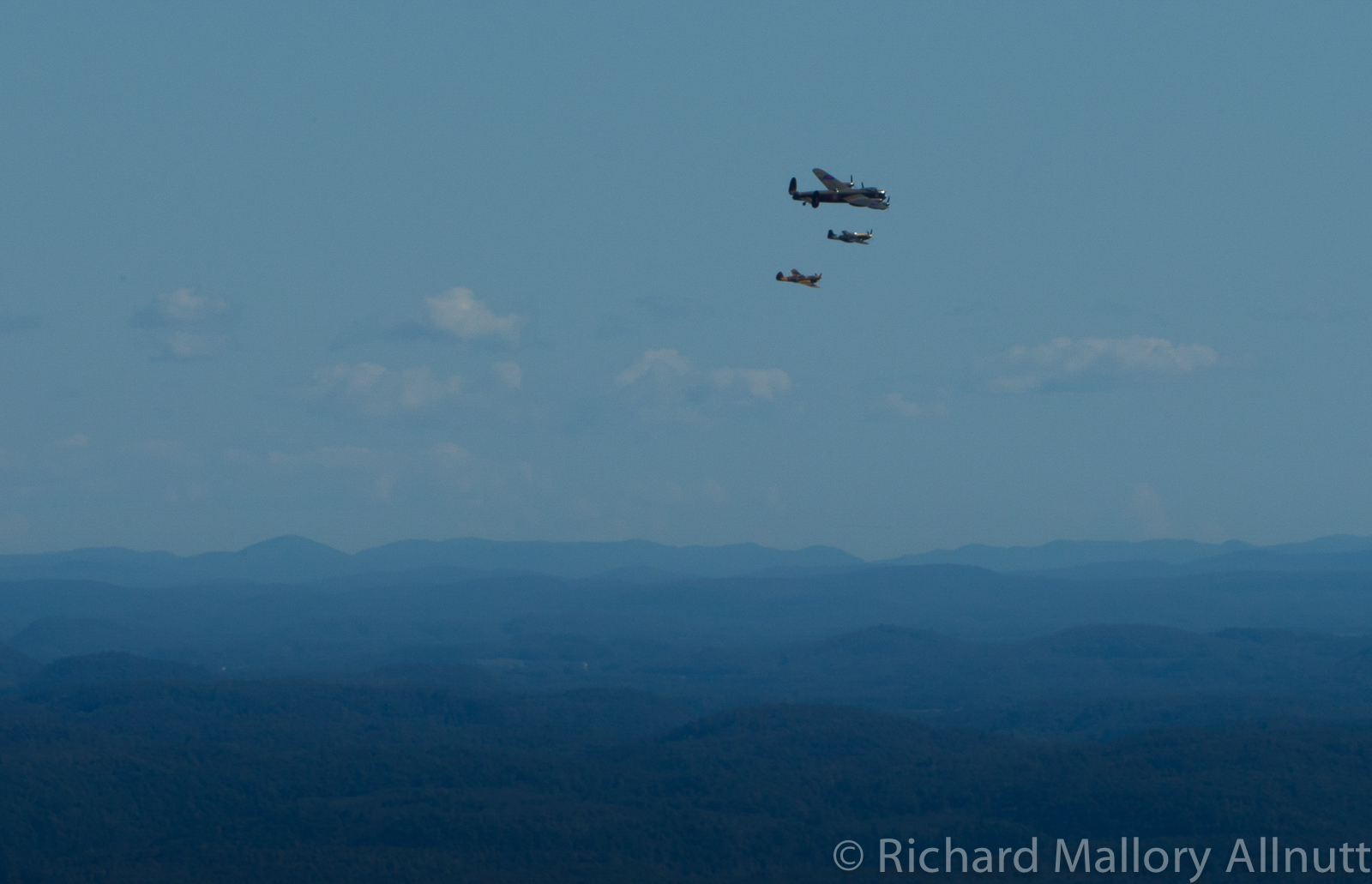 The Lancaster, Mustang and Kittyhawk over the Gatineau Hills. (photo by Richard Mallory Allnutt)
