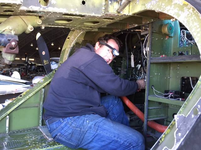 Working on the radios in the nose bay. (photo via CAD A-26 Invader Squadron)